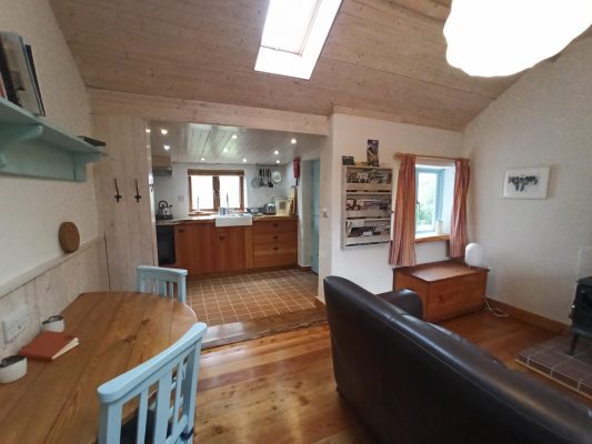 Interior of Birch Cottage living room and dining table a warm off-grid cottage in County Down
